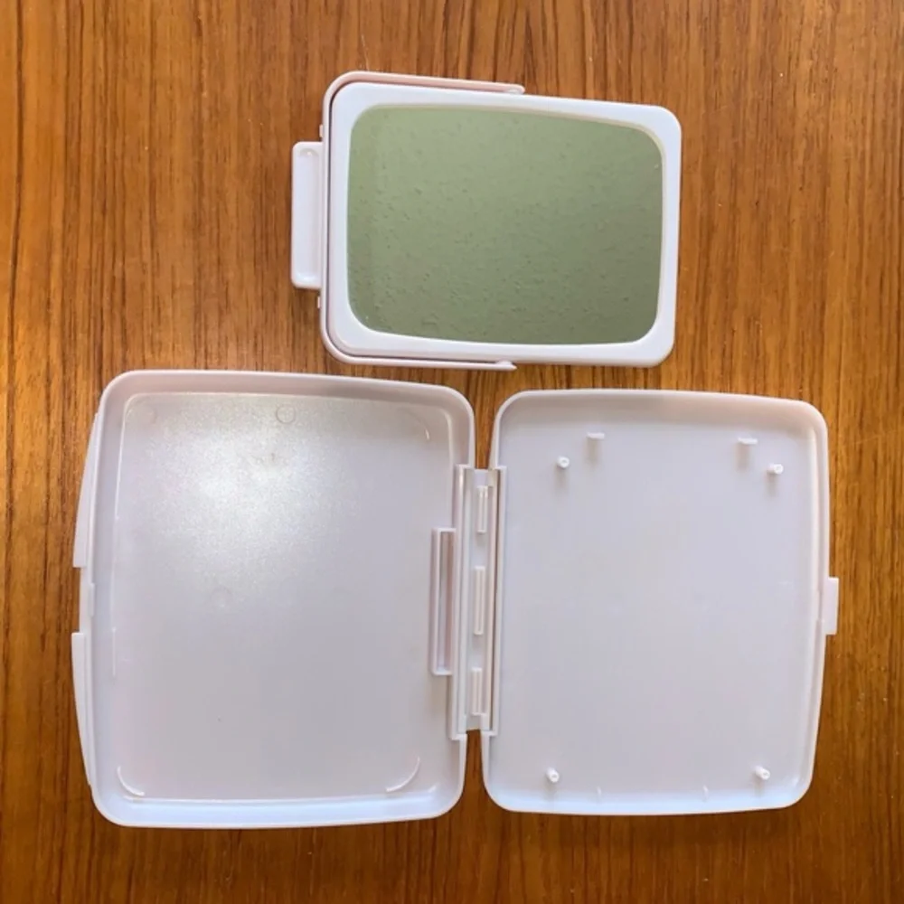 Mary Kay pink plastic compact travel mirror.